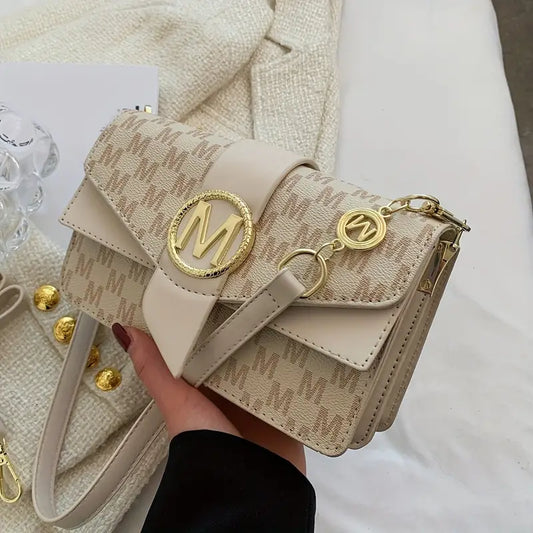 AUDREYโข RETRO LETTER BUCKLE GRAPHIC CROSSBODY BAG